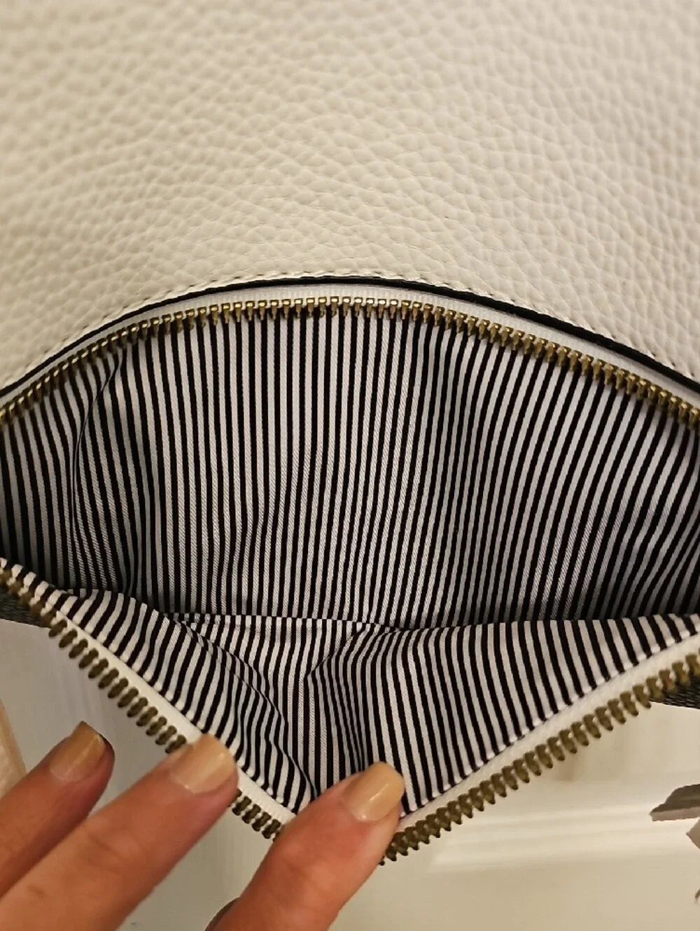 Two-Tone White and Black Crossbody Bag with Tassel Accent
